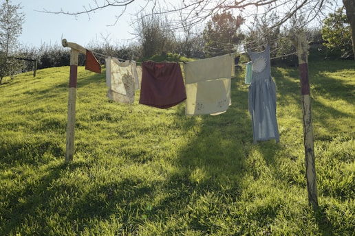 Laundry is drying on a clothesline outdoors.