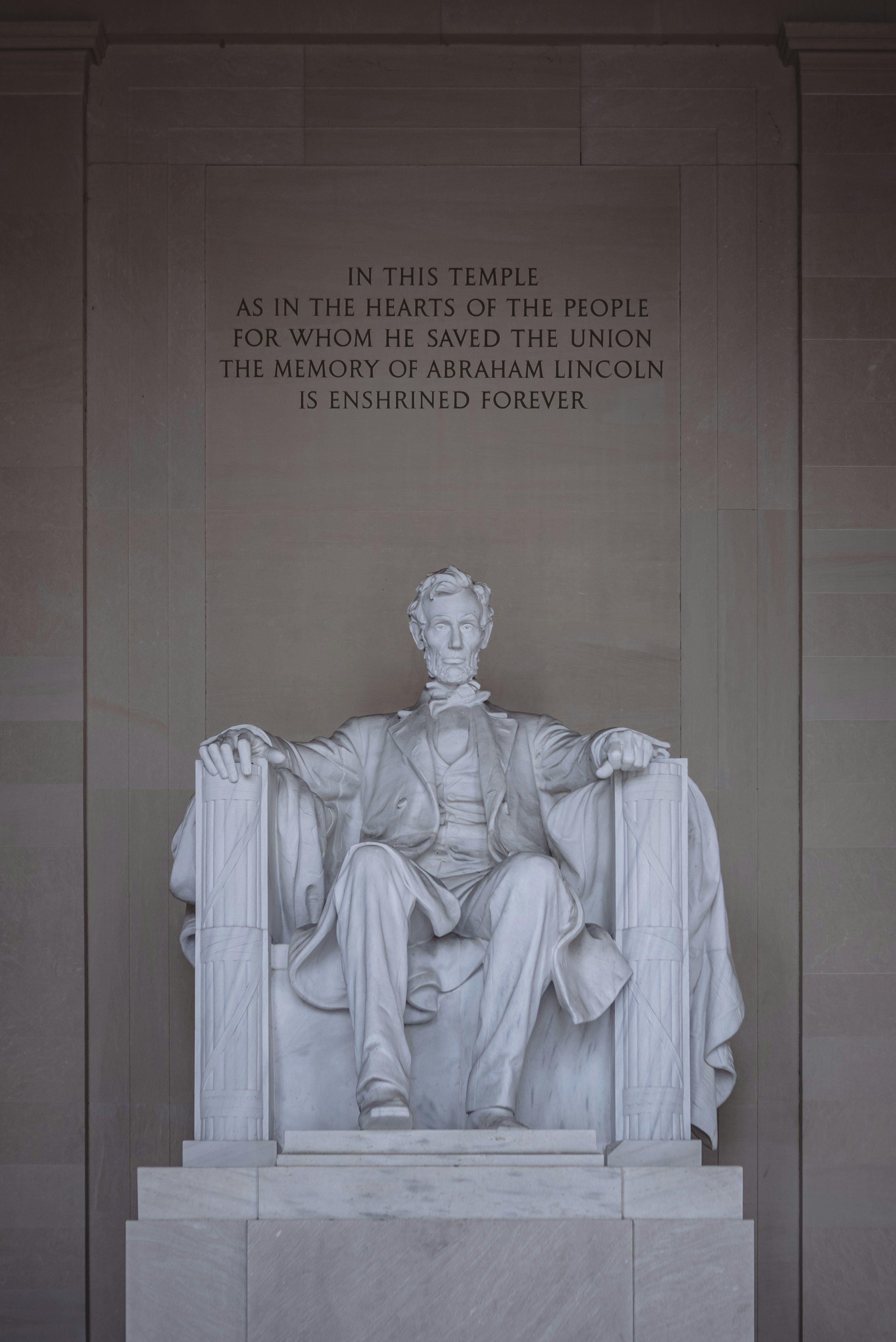 A statue of abraham lincoln resides in a temple.