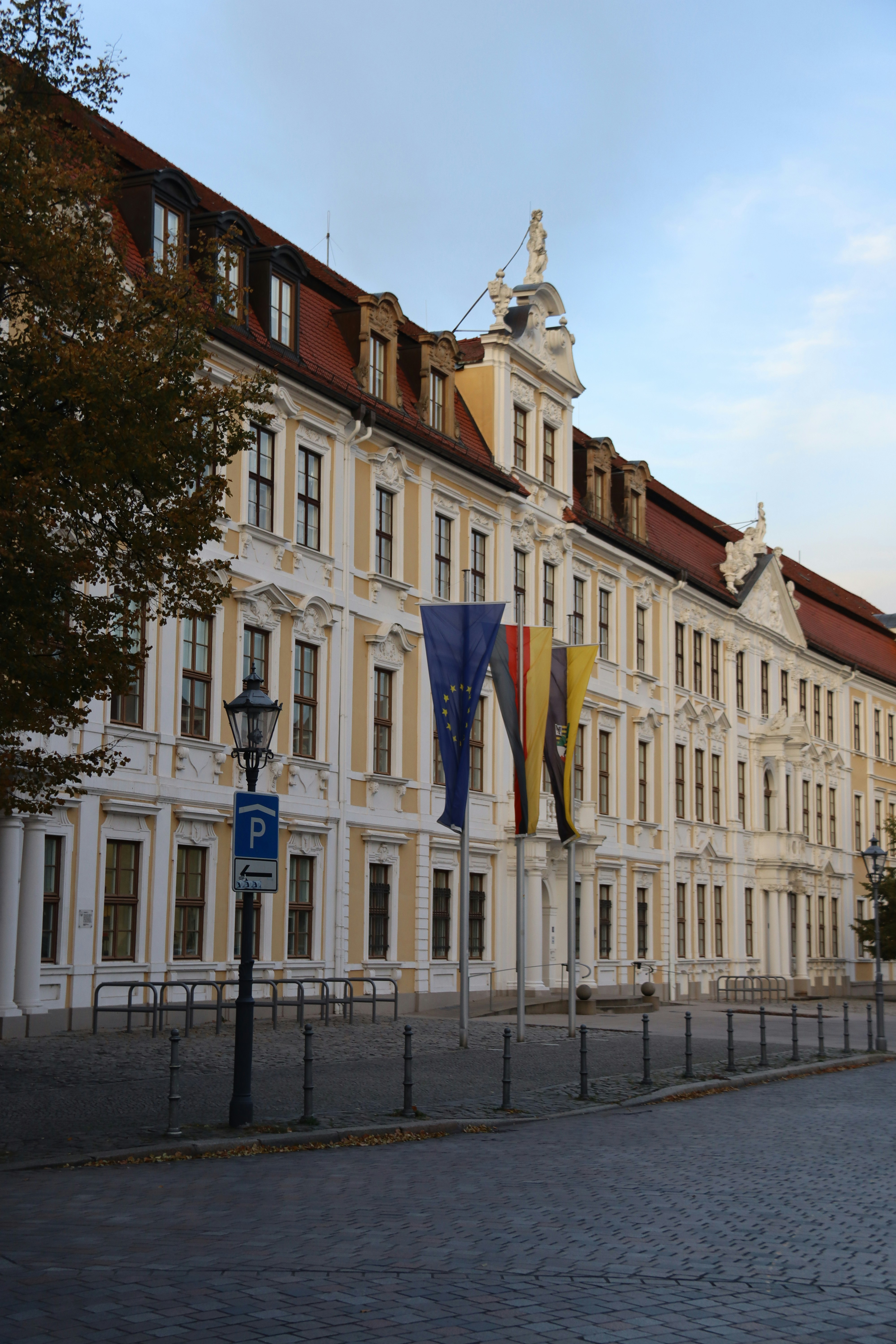 A grand building with flags in front. photo – Free Germany Image on ...