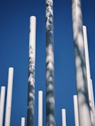 White columns stand against a brilliant blue sky.