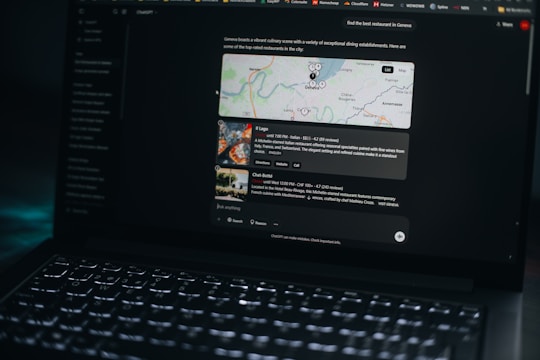 Laptop screen shows a map and related information.