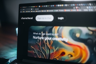 A laptop displays a website promoting creativity.