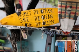 Surfboards show a message about protecting the ocean.
