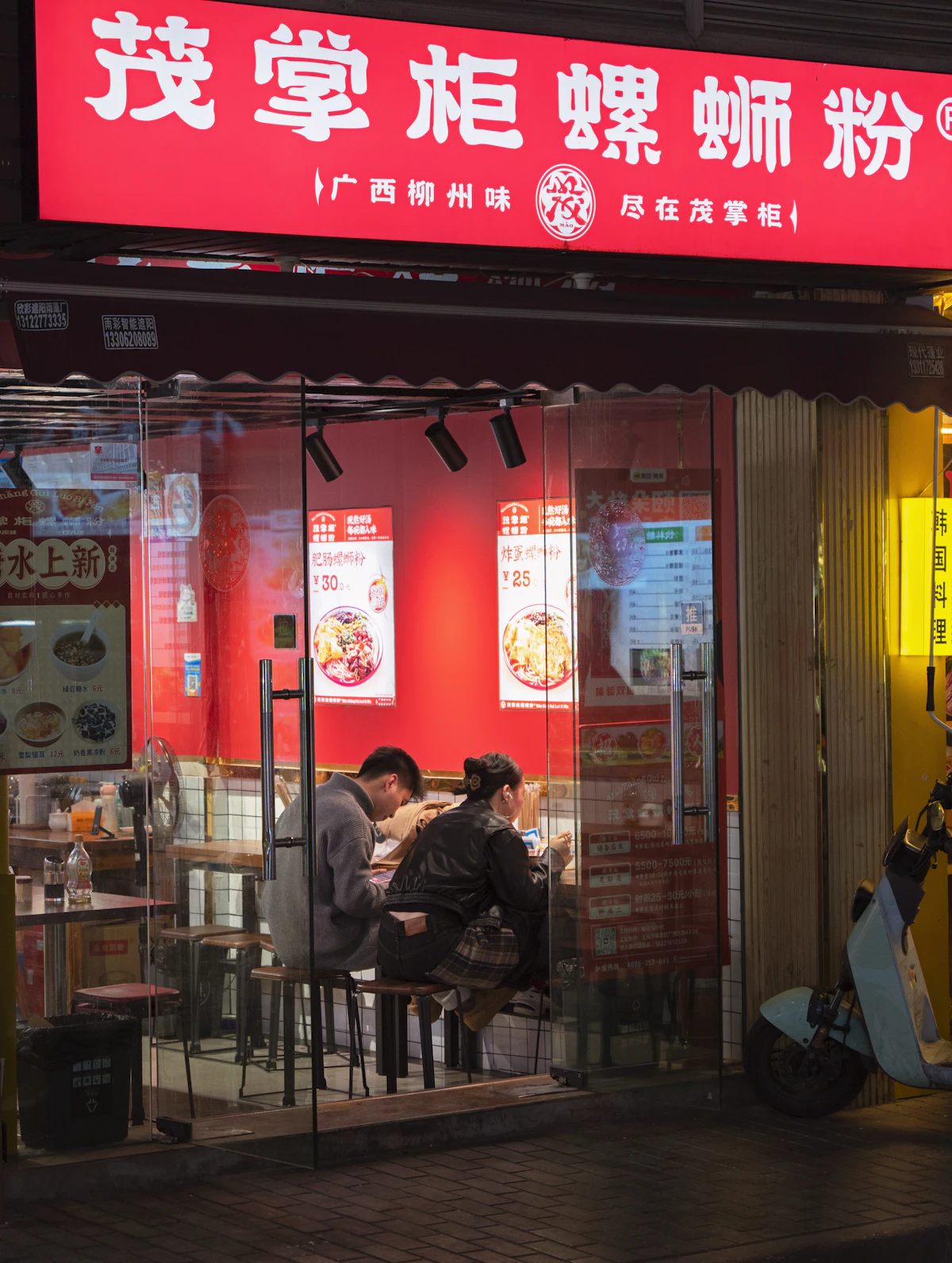 Couple enjoying a casual street food crawl together and laughing outdoors