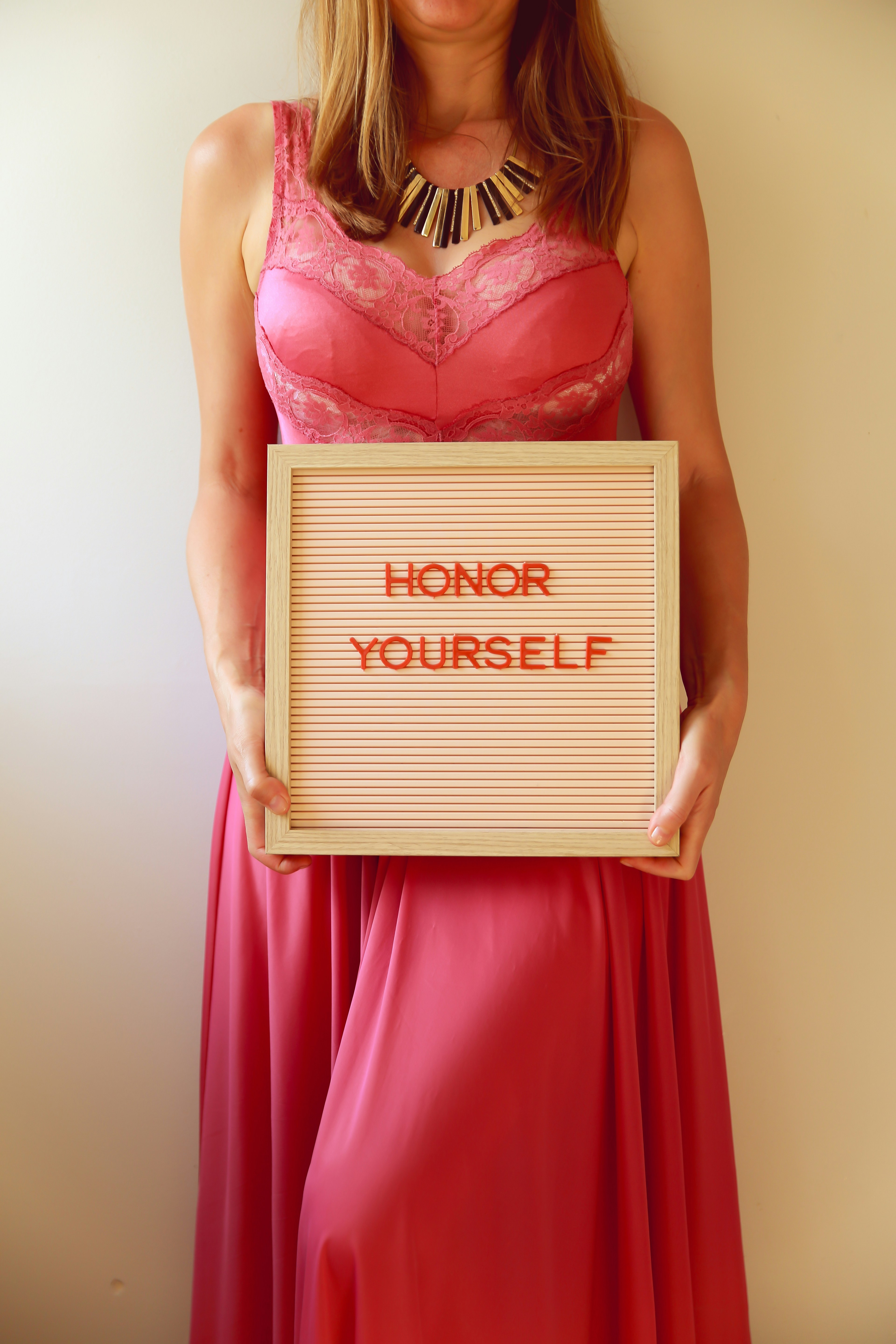 Woman holding a sign that says 