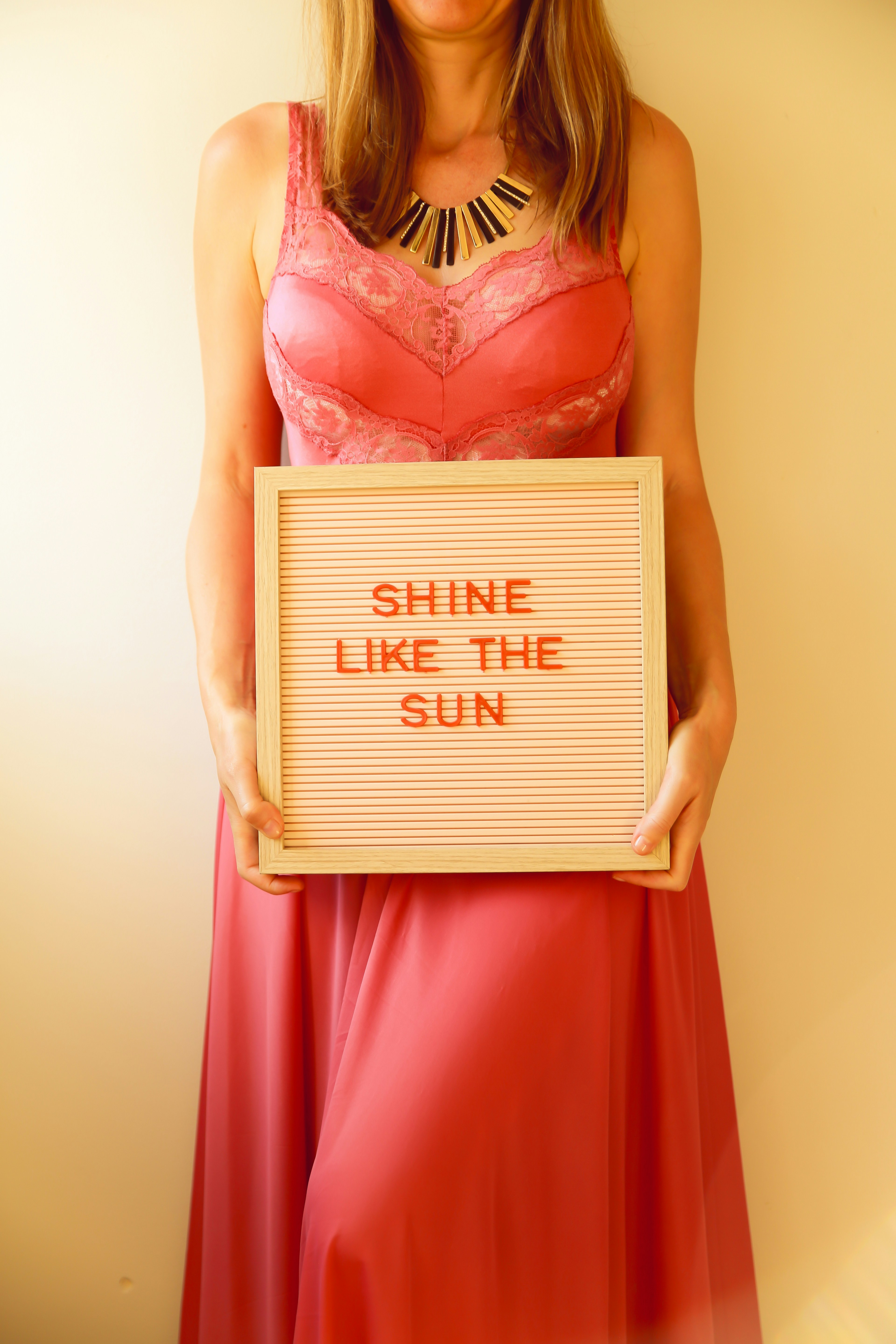 Woman holds sign that says 