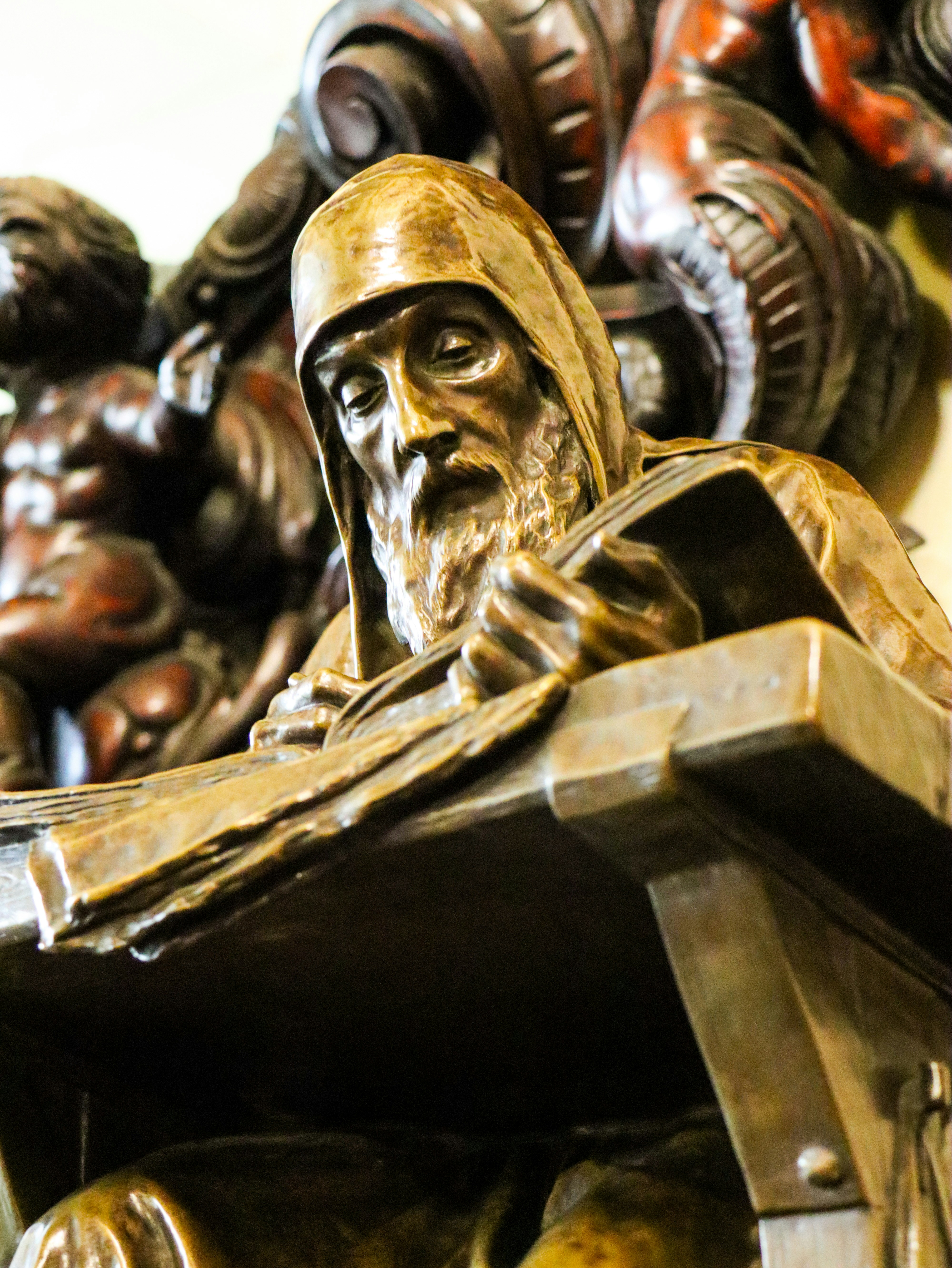 Statue of a man reading a book.