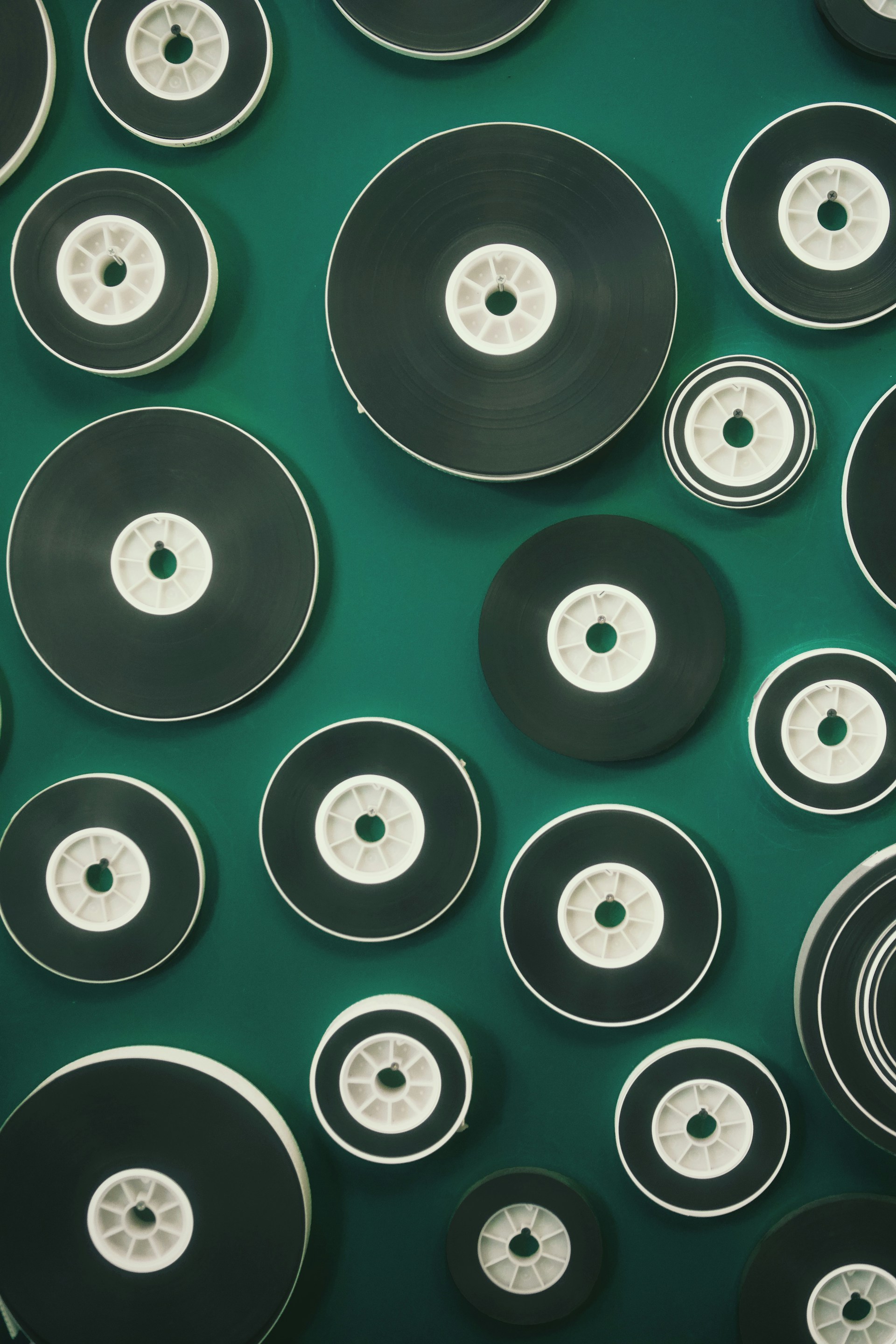 Discs of varying sizes are arranged on green.