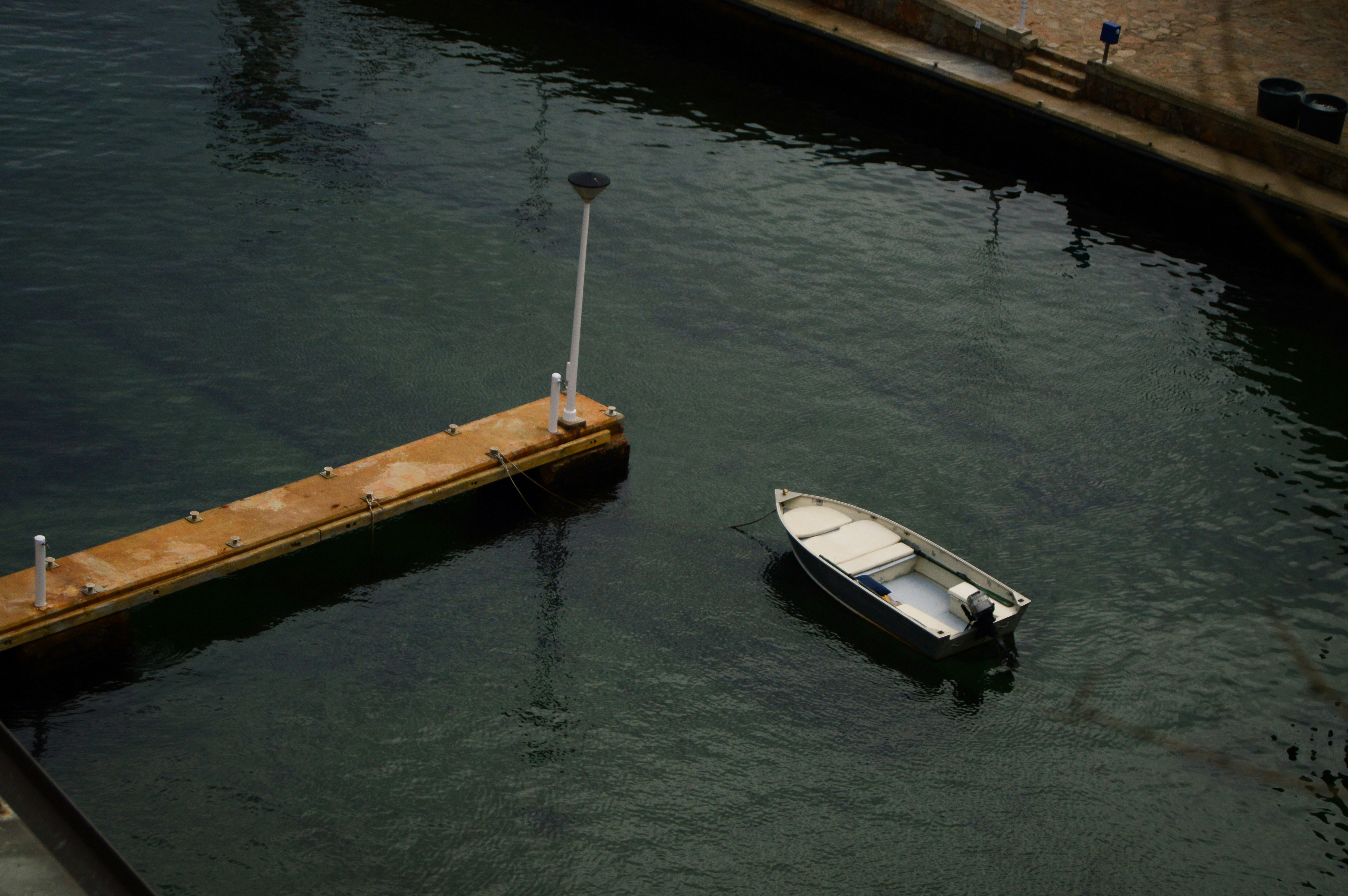 floating dock with a boat tied