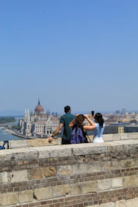 People take pictures with a scenic city view