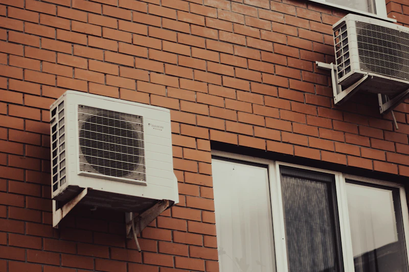Air conditioning units on a brick wall