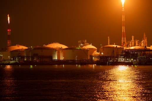 Oil refinery lit up at night.
