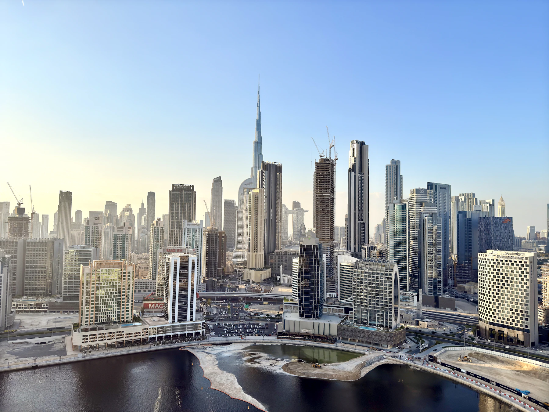 Dubai skyline and the Burj Khalifa rising above the waterfront in daylight