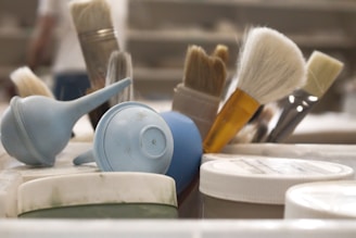 Art brushes, tools, and supplies are visible.