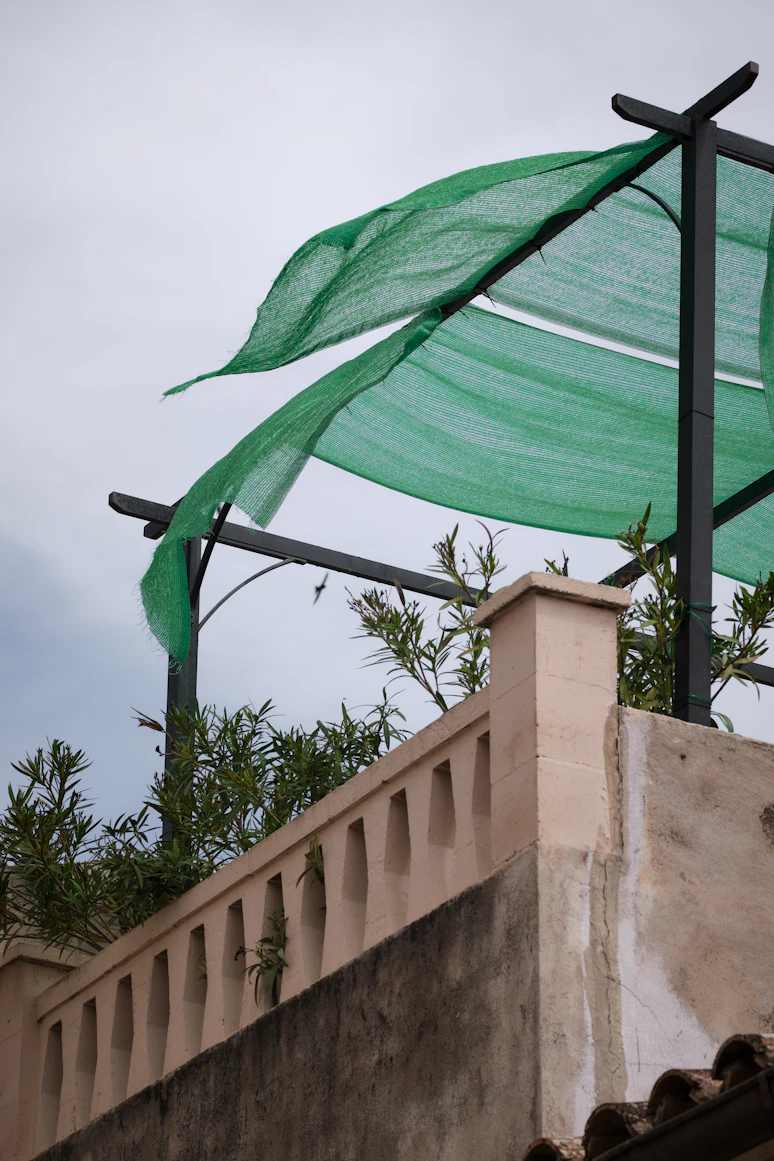 Greenhouse shade netting used
    to protect garden from sun and wind