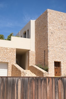 A modern home displays stone walls and simple design.