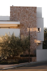 Modern building with stone and white facade.