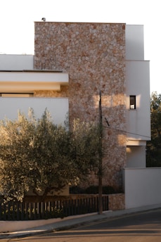Modern building with stone and white facade.
