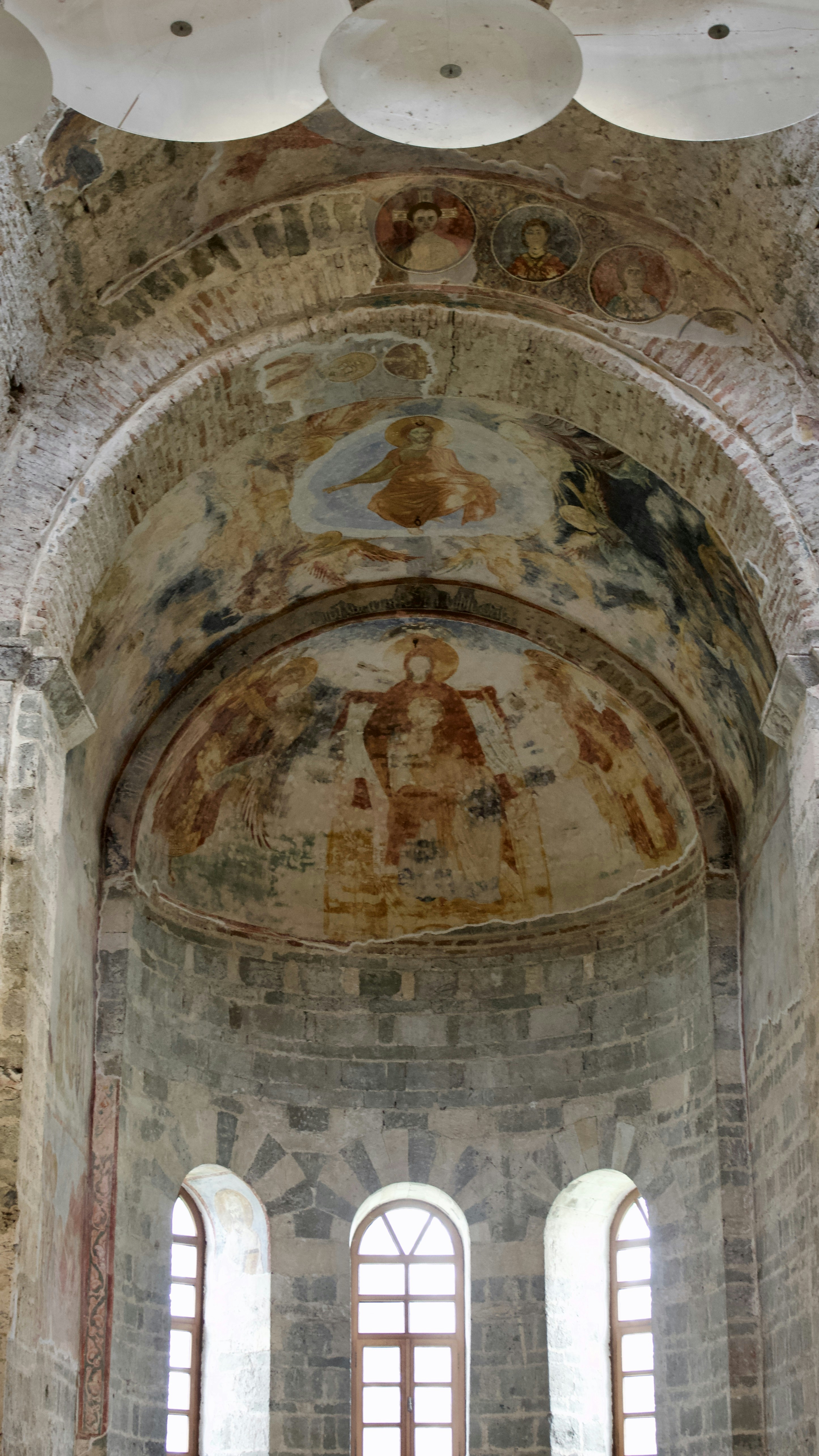 Old church with religious frescoes on the wall.