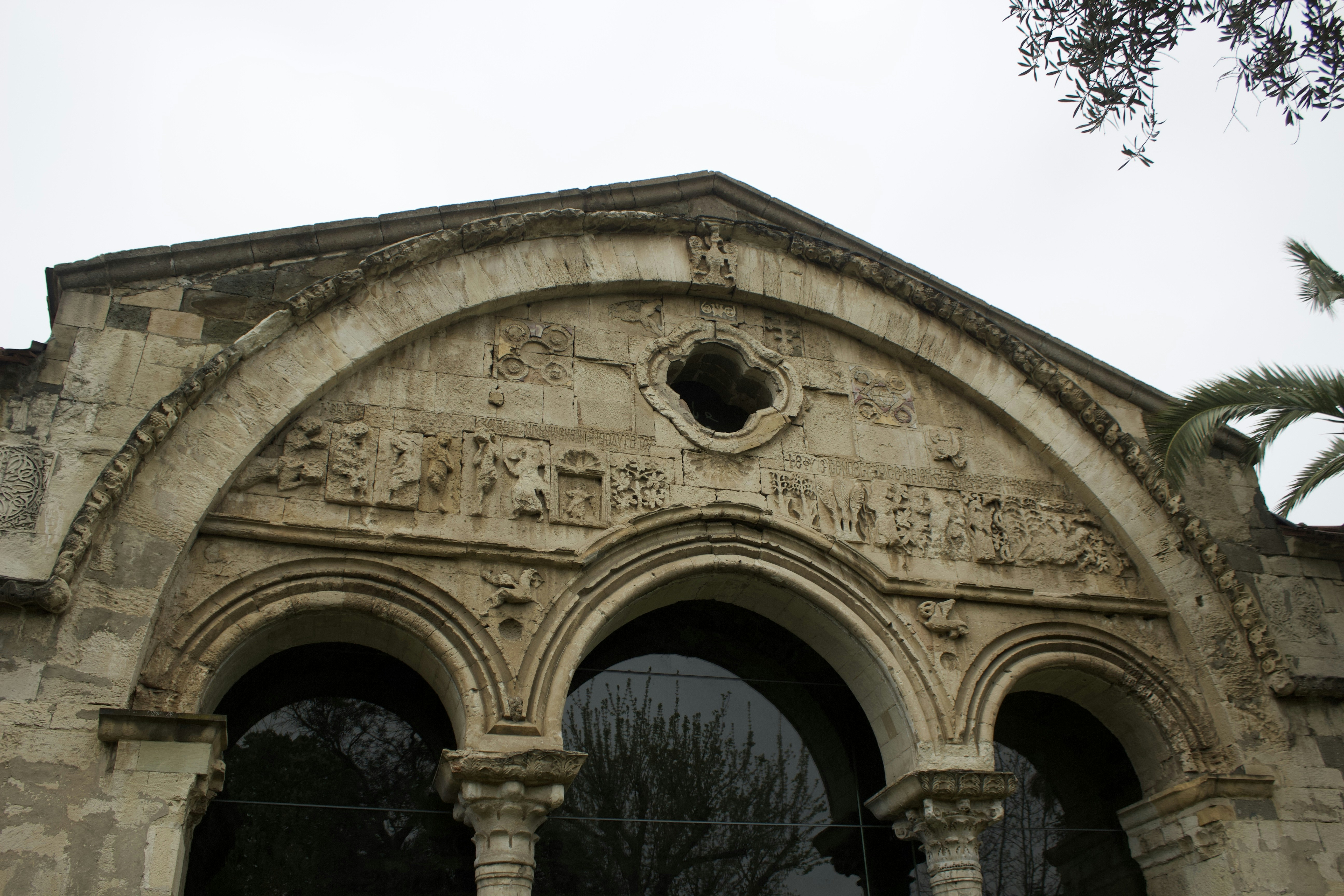 An arched doorway with intricate stone carvings.