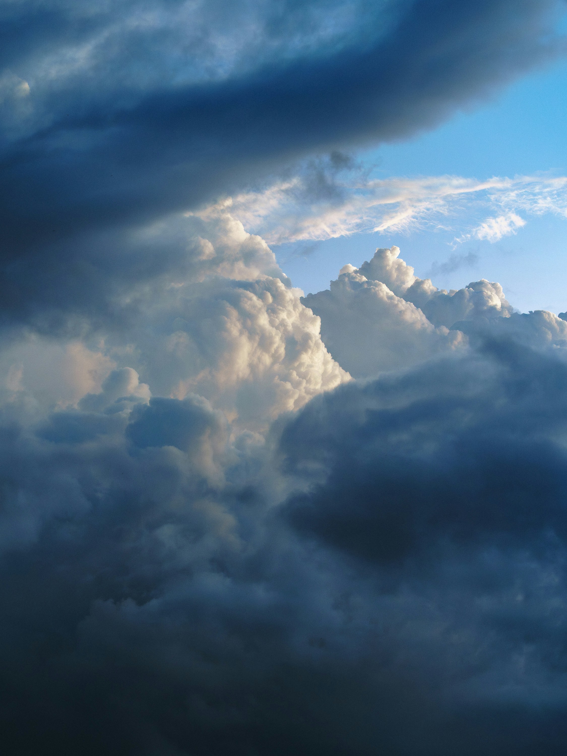 Dramatic clouds in a cloudy, blue sky.