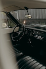 Interior view of a vintage car's cockpit.