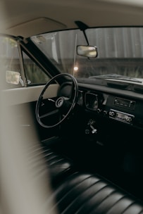 Interior view of a vintage car's cockpit.