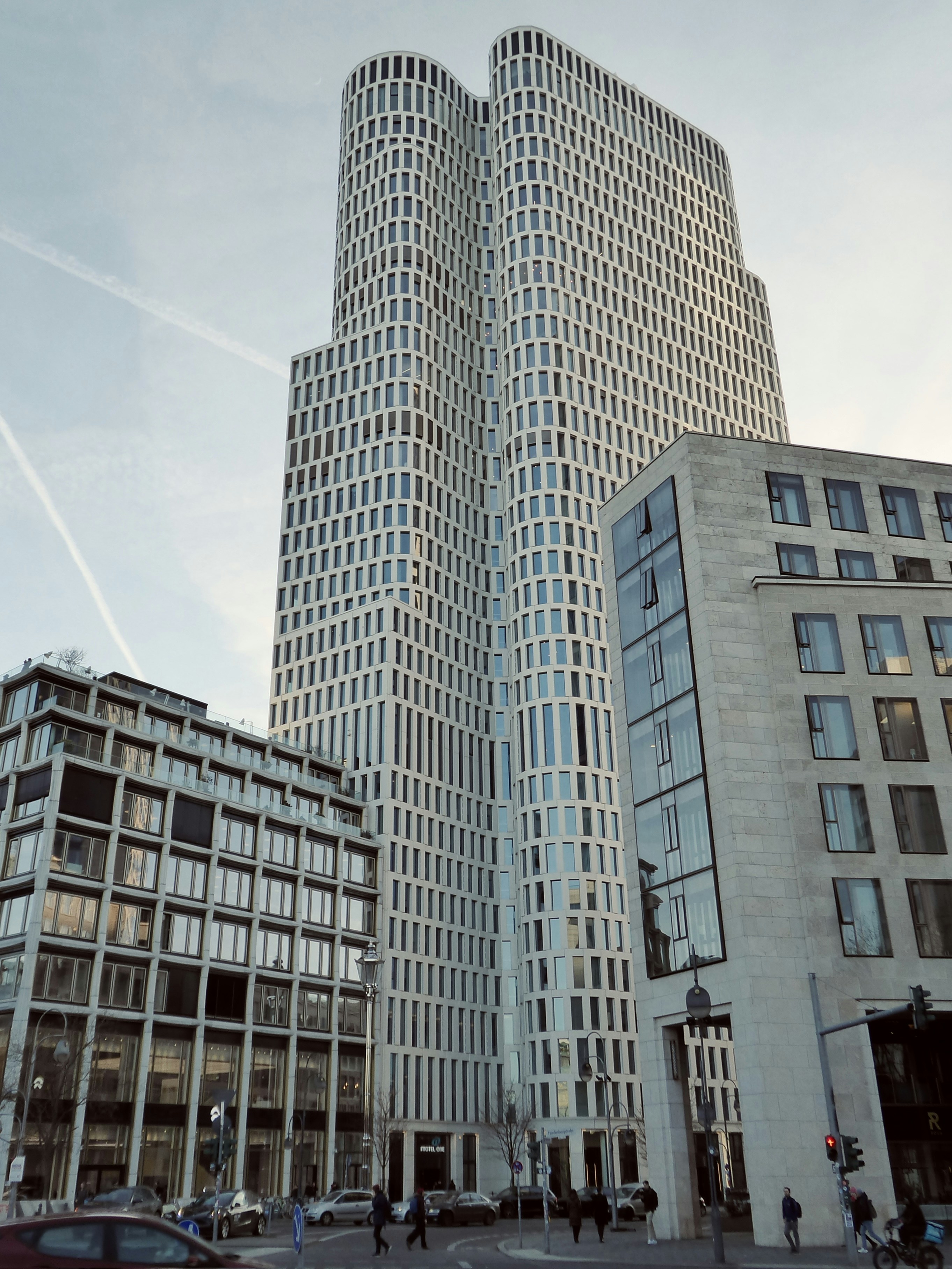 A modern, towering skyscraper stands tall.