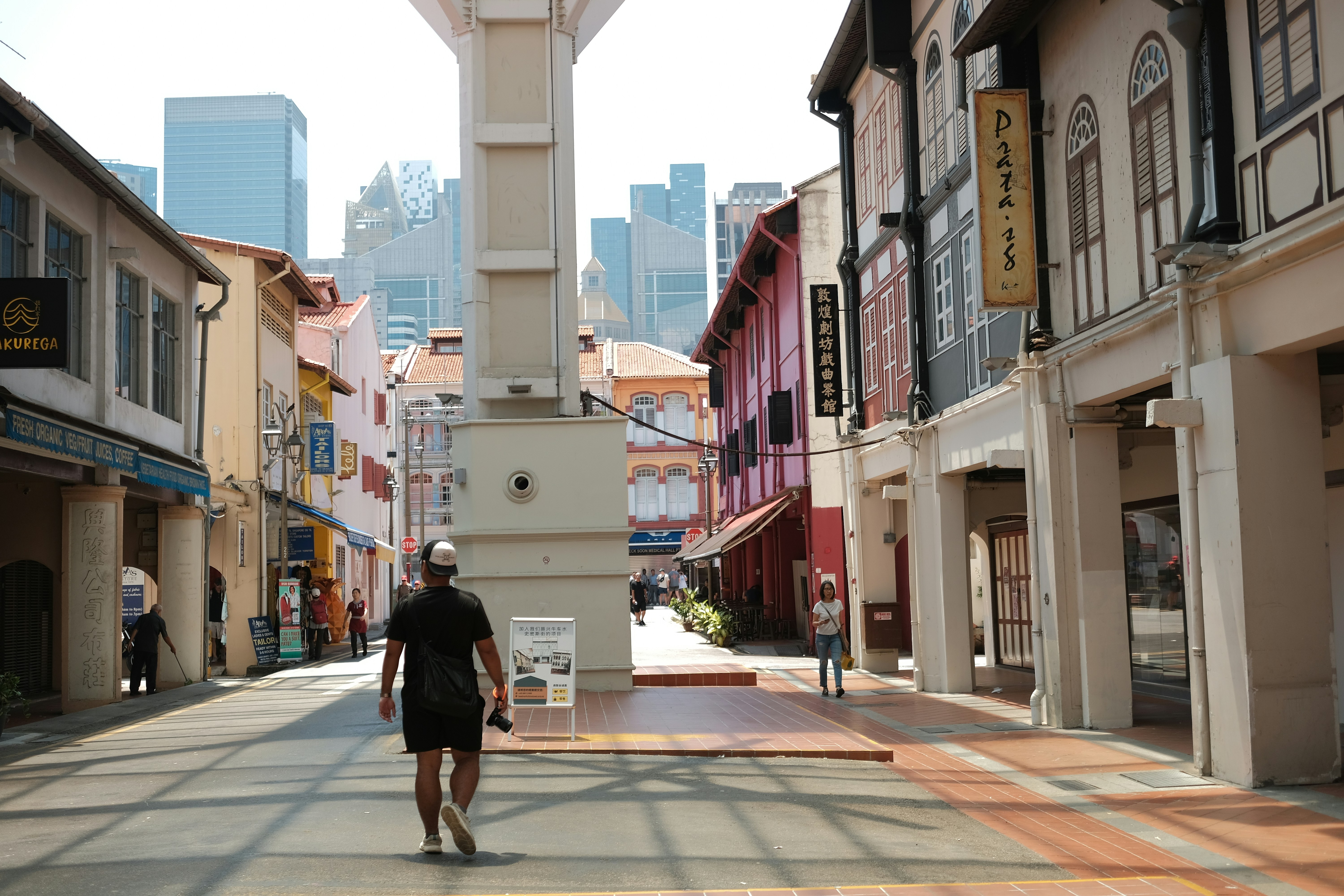 A street in singapore with historic buildings.