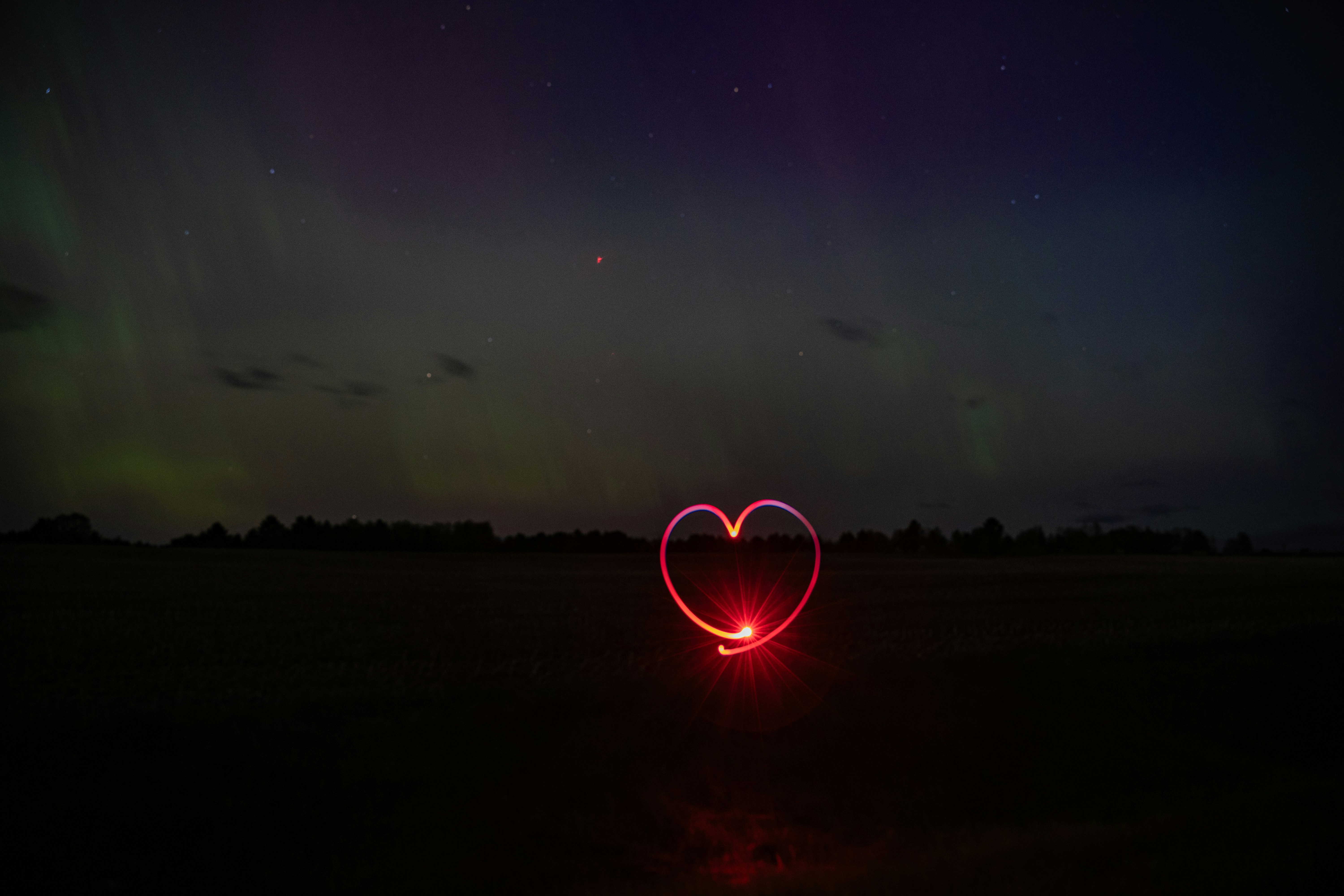 Red heart in dark night