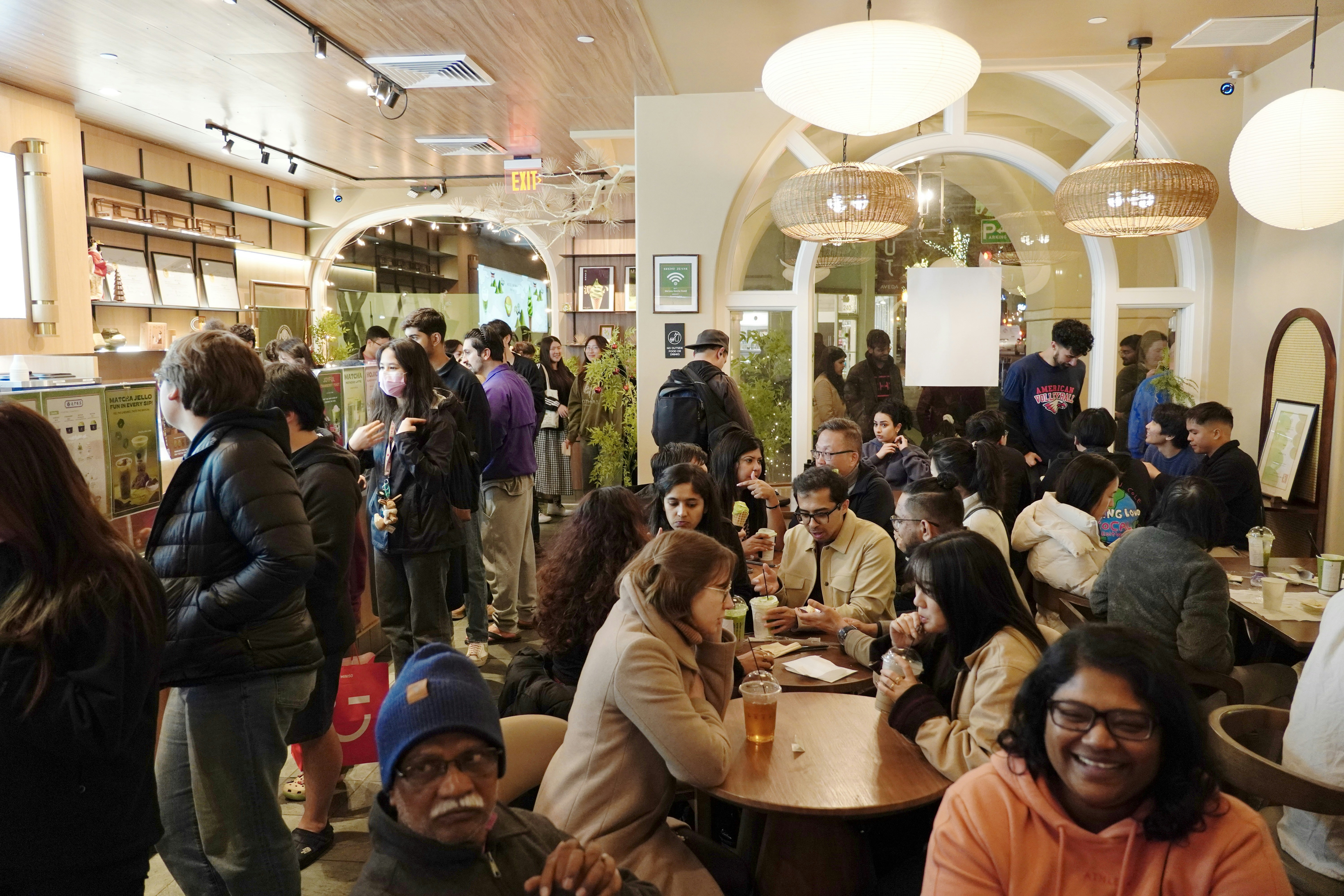 Vibrant café interior with lively crowd