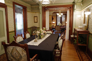 A vintage dining room table is set for a meal.