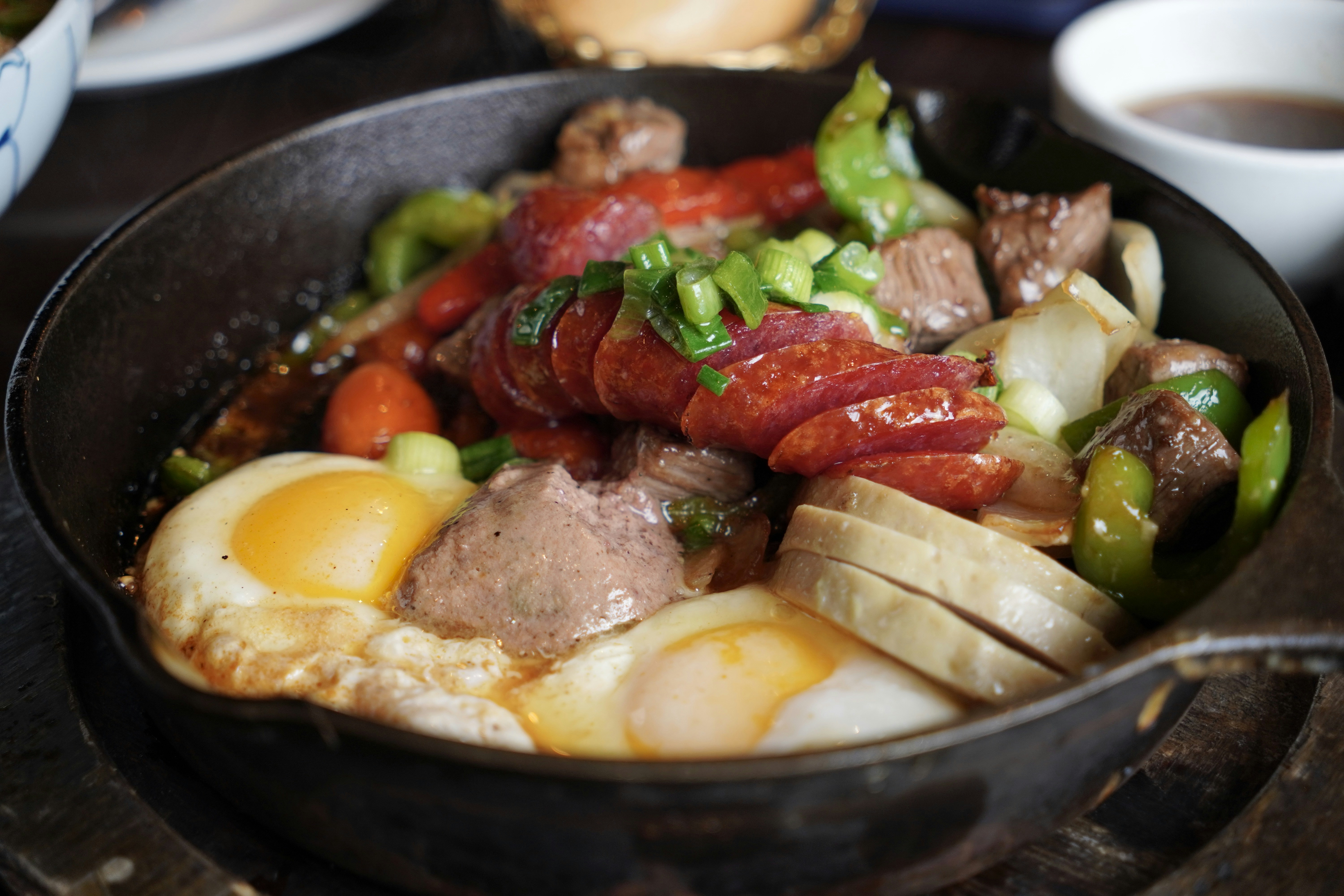 Sizzling skillet with vibrant ingredients