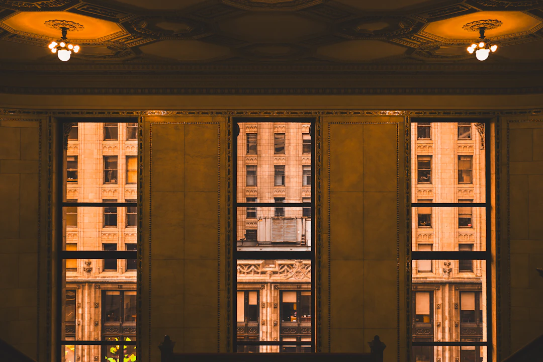 Tall windows frame buildings outside