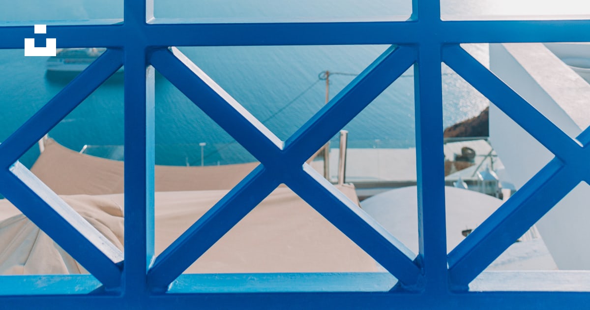 Blue railing overlooks the stunning greek coastline. photo – Free Beach ...