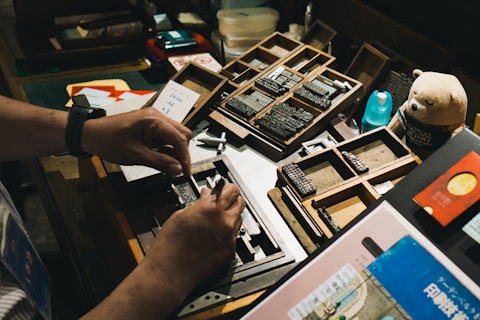 Someone is working with letterpress printing equipment.