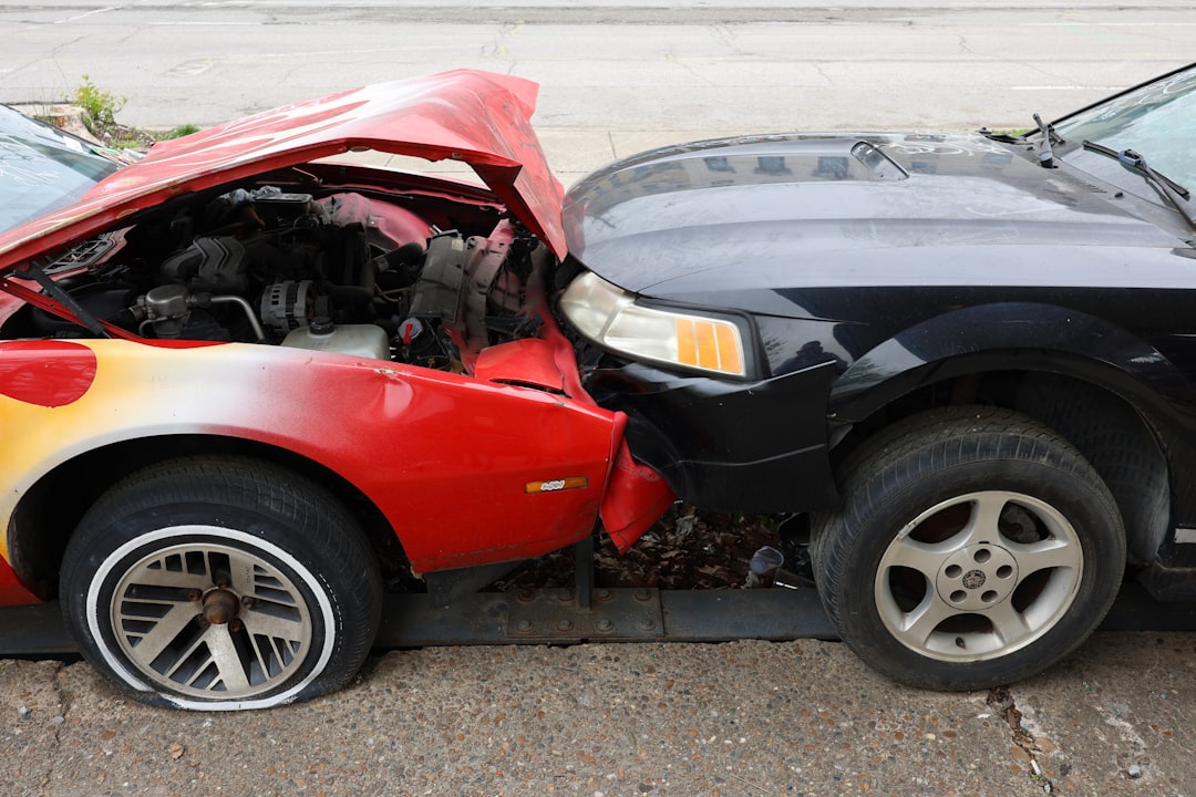 Cars are involved in a frontal collision.,