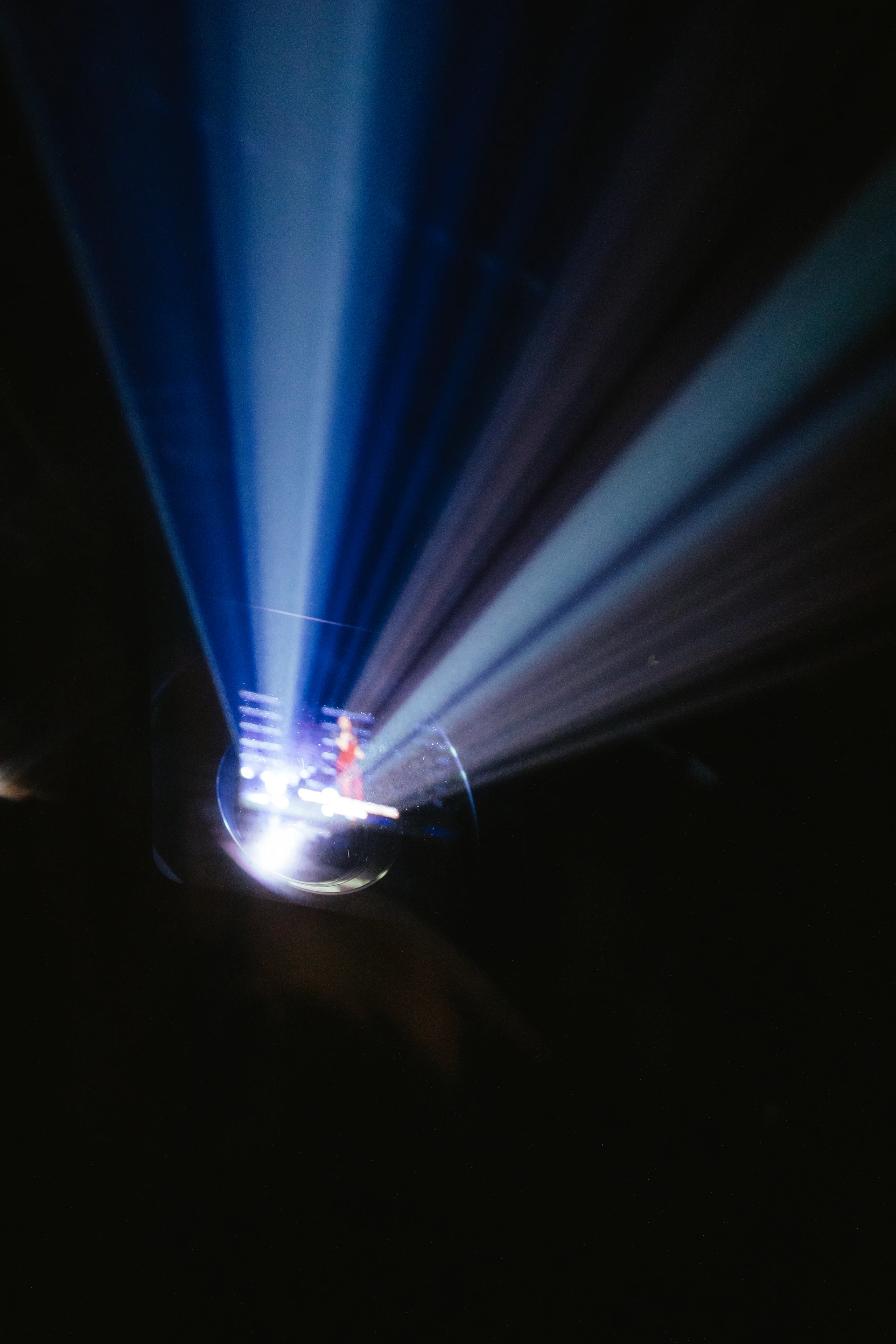 A bright beam of light shines from above.