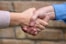 Two people are shaking hands.