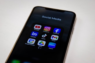 Social media apps are displayed on a smartphone.