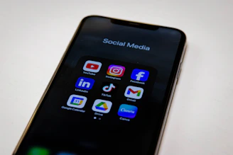 Social media apps are displayed on a smartphone.