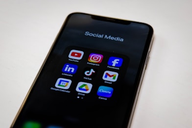 Social media apps are displayed on a smartphone.