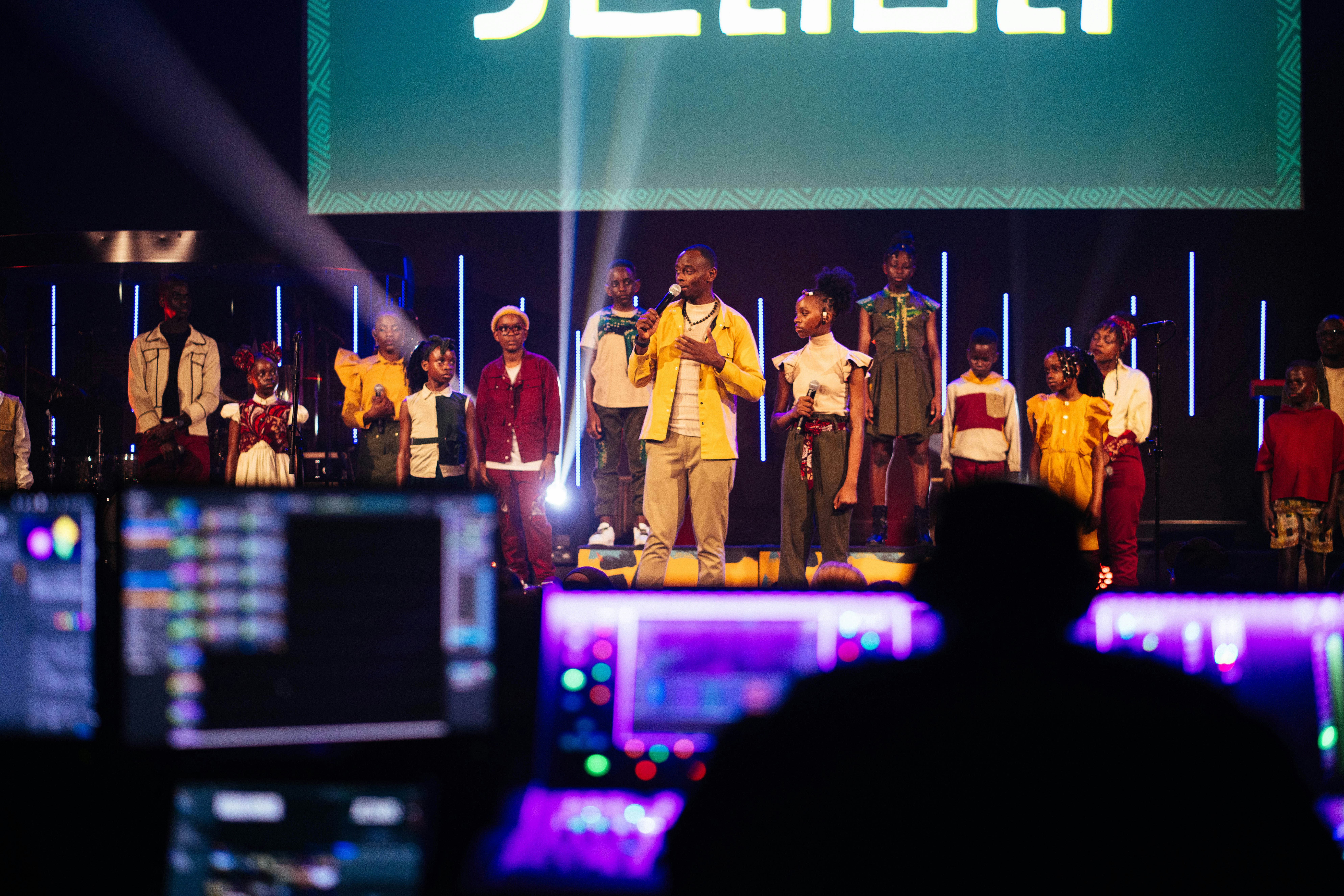 A choir sings on stage during a concert.