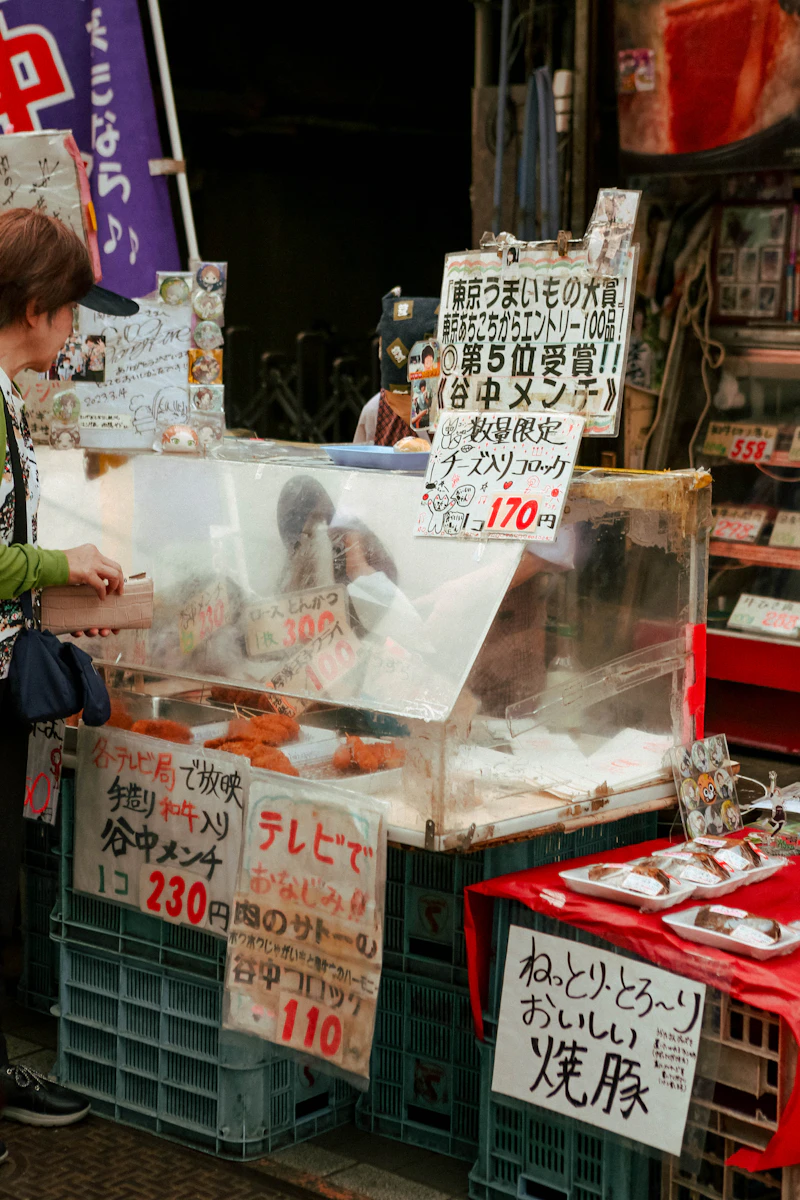 Japan — shopper at a Tokyo street-food stall
