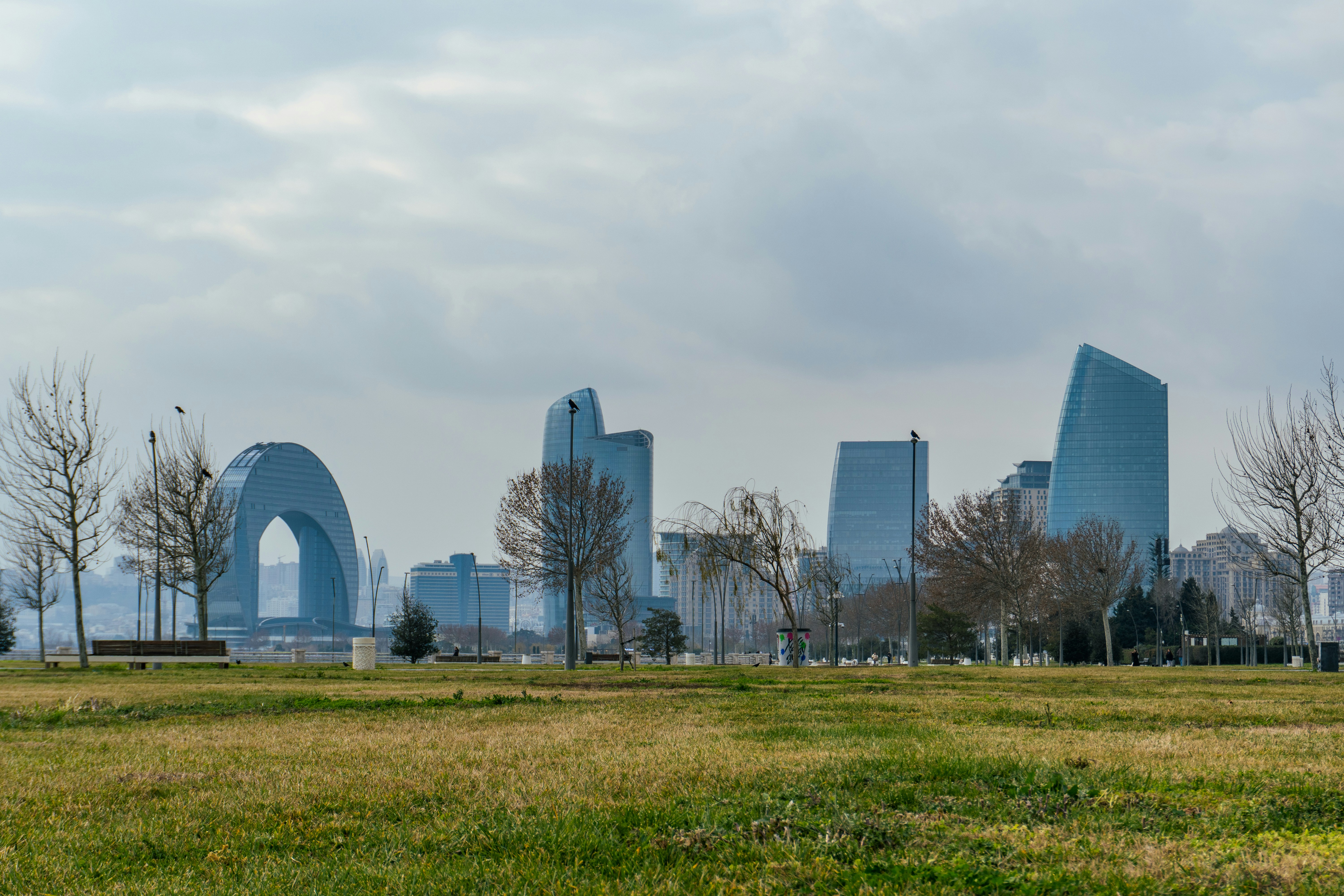 Modern city skyline with unique architectural structures.