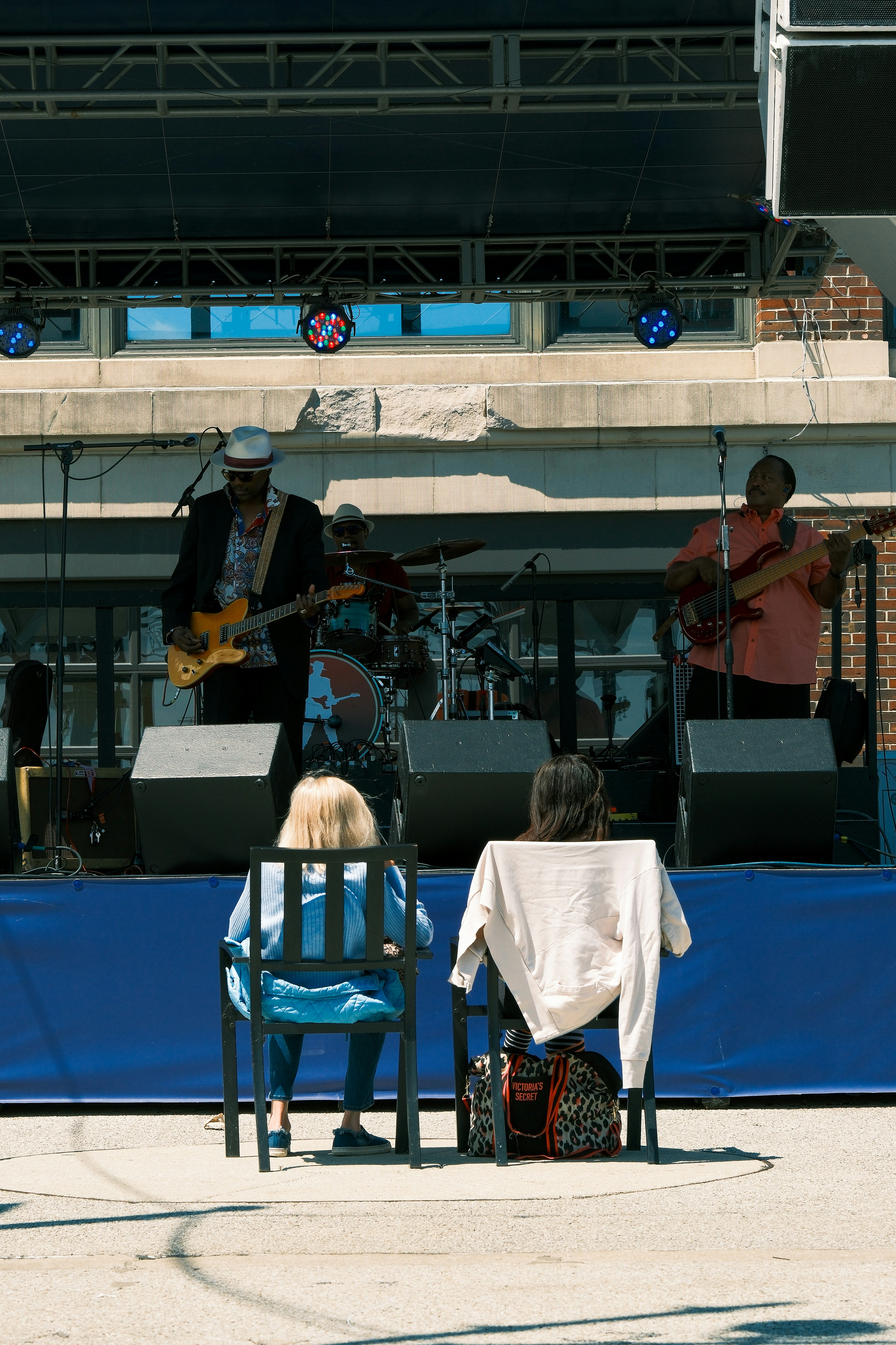A band performs on stage for an audience.