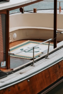 A beautiful yacht with deck and rug.