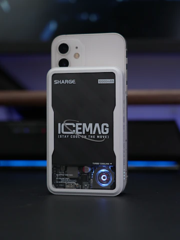 A phone with a cooling device attached.