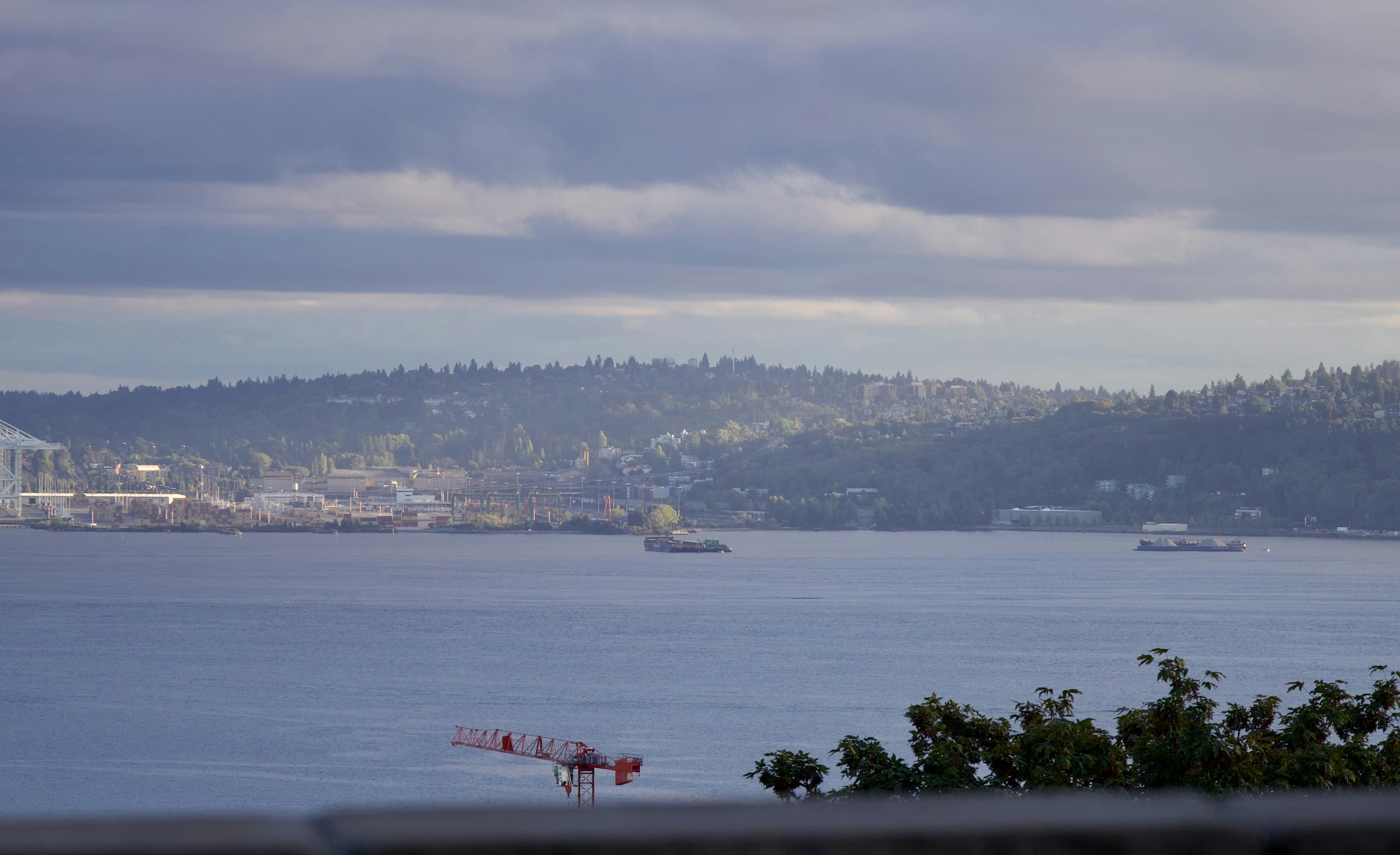A calm body of water with distant land.