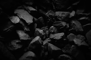 Pile of dark gray rocks in black and white.